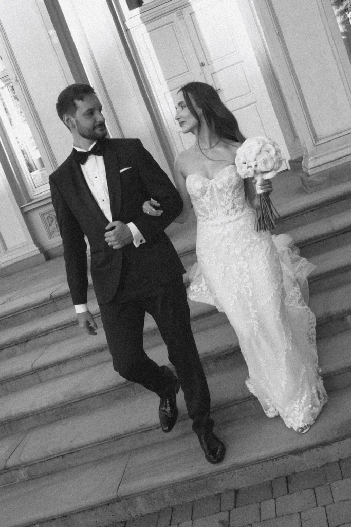 Bride and groom walking down the palace steps