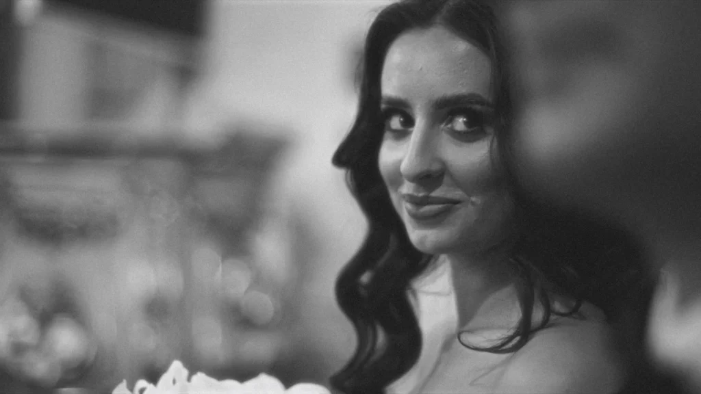 Bride glancing over her shoulder with a soft smile